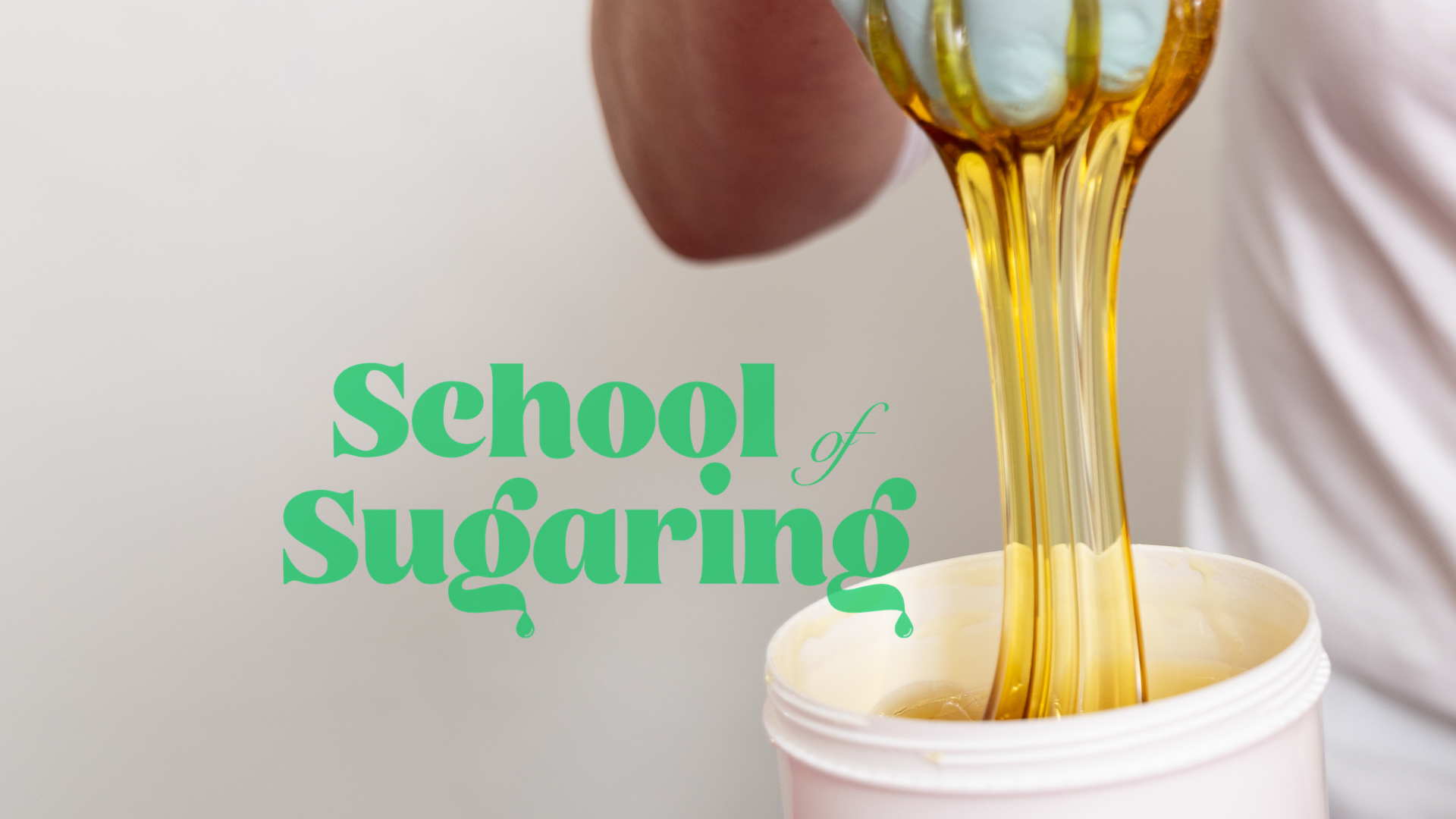 Professional sugaring hair removal treatment demonstrating technique